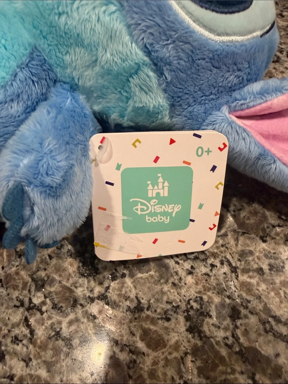 Disney Plush Character in Light Blue and Pink Accents